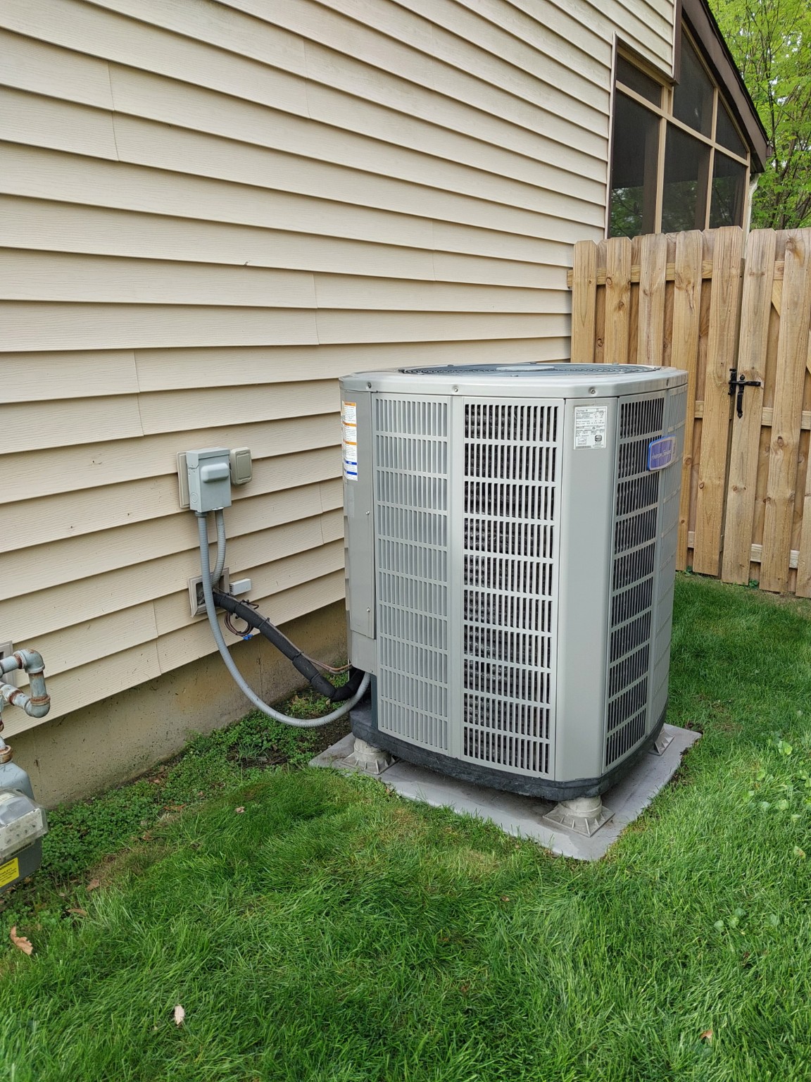 Real HHC field photograph of residential outdoor air-conditioning equipment